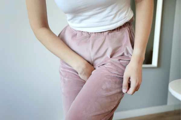 woman running for the toilet because of urinary incontinence Cheshire